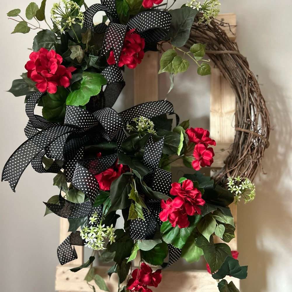 Festive Red Floral Wreath with Black Accents